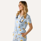Three Pocket Smiley Face Daisy Print Scrub Top